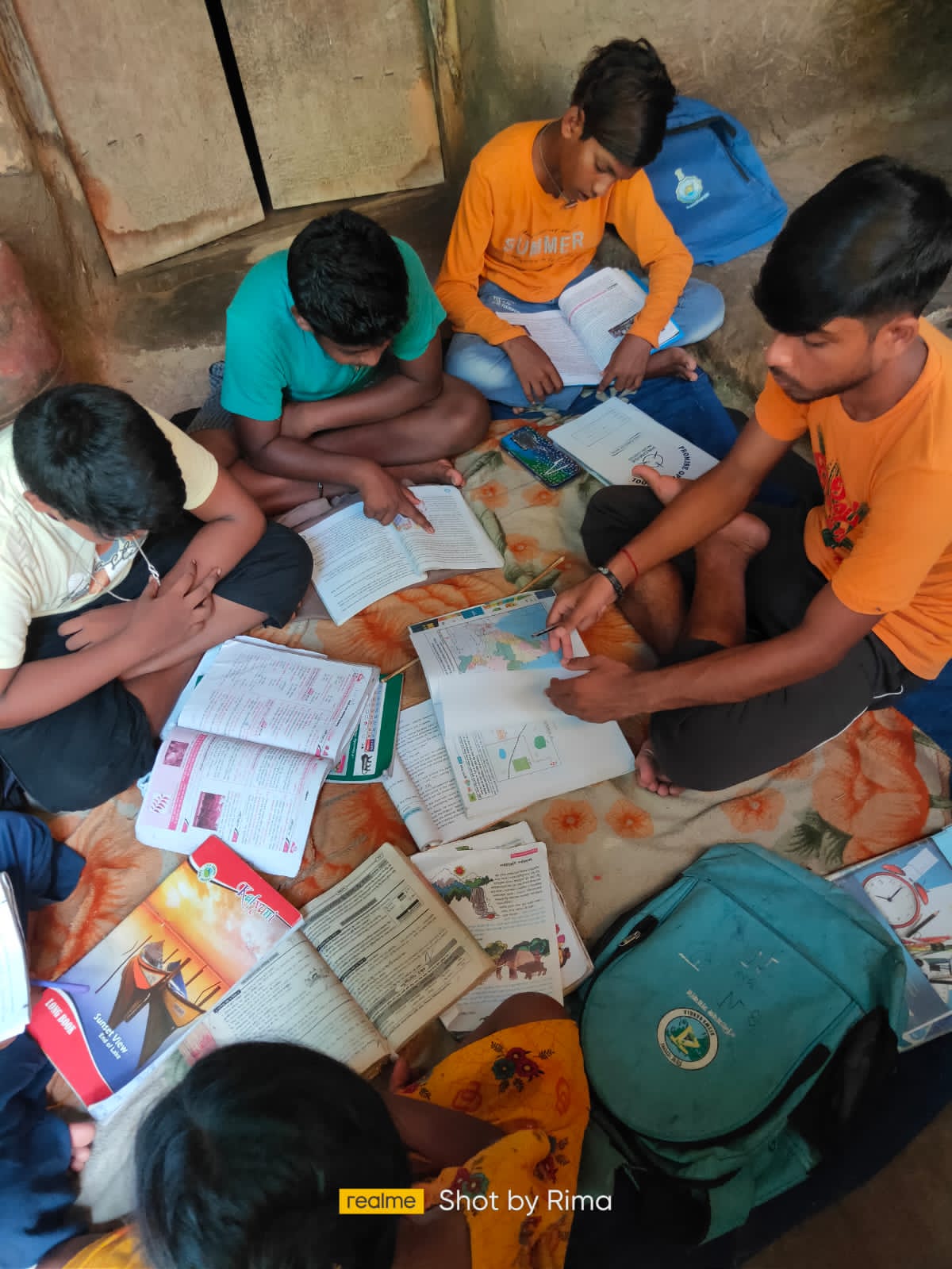Volunteer teaching children in a rural study center